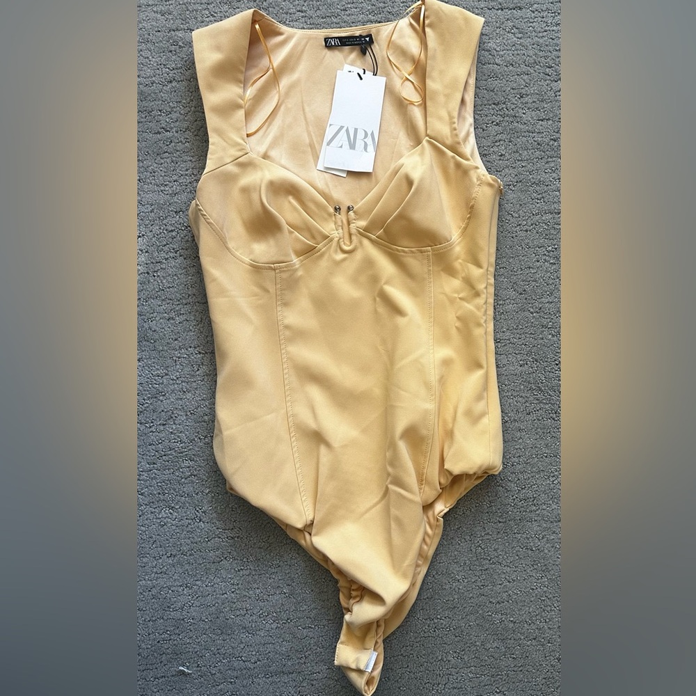Yellow bodysuit